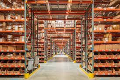a long warehouse with shelves and boxes