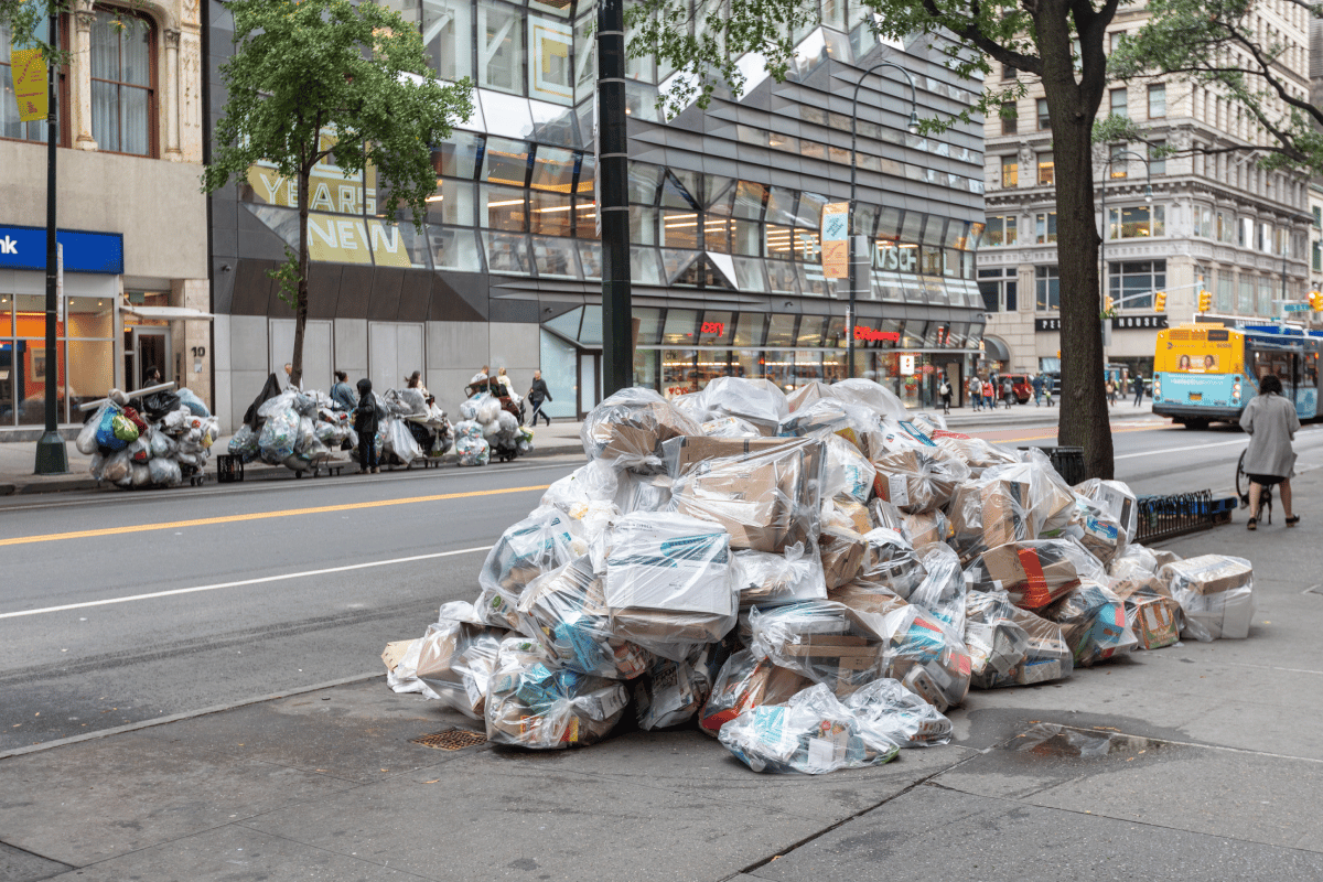 a pile of garbage on a city street